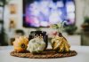 Fall Home Refresh: Meet the Jersey City Designer Behind Narine + Co. Stylish autumn decoration with pumpkins and candles in a cozy living room setting.