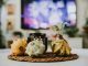 Stylish autumn decoration with pumpkins and candles in a cozy living room setting.