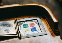 Hoboken Approves $11.2M Bond for Trucks, Roads, and HVAC Wooden voting panel with multilingual buttons in Bern's Parliament, Switzerland.