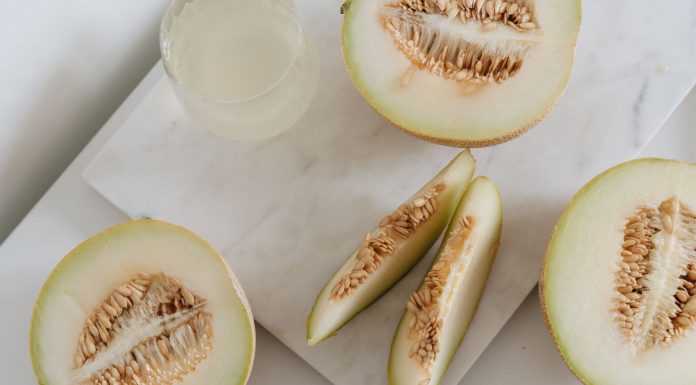 Delicious sliced melon resting on a smooth marble surface, highlighting freshness and nutrition.