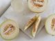 Delicious sliced melon resting on a smooth marble surface, highlighting freshness and nutrition.
