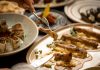 Close-up of a gourmet meal with diverse dishes, showcasing fine dining and sophisticated presentation.