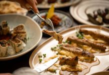 Close-up of a gourmet meal with diverse dishes, showcasing fine dining and sophisticated presentation.