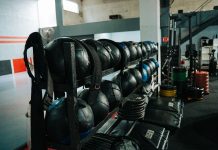 Well-equipped indoor gym featuring kettlebells, weights, and workout gear, perfect for fitness enthusiasts.