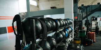Well-equipped indoor gym featuring kettlebells, weights, and workout gear, perfect for fitness enthusiasts.