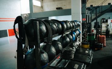 Well-equipped indoor gym featuring kettlebells, weights, and workout gear, perfect for fitness enthusiasts.