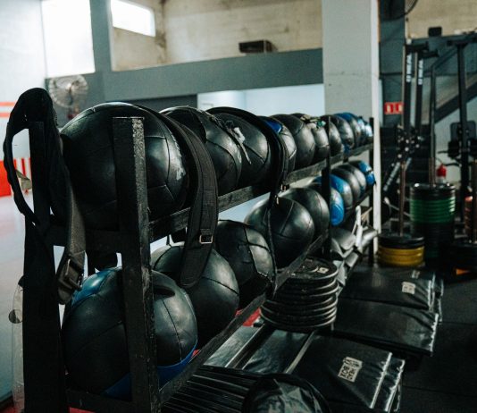 Well-equipped indoor gym featuring kettlebells, weights, and workout gear, perfect for fitness enthusiasts.