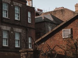 An old urban scene showcasing brick buildings with a vintage charm and architectural details.