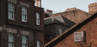 An old urban scene showcasing brick buildings with a vintage charm and architectural details.