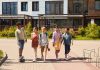 A diverse group of children walking outdoors, symbolizing friendship and multicultural unity.