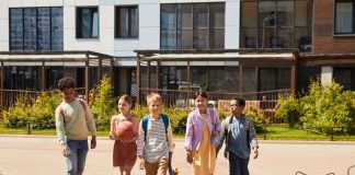 A diverse group of children walking outdoors, symbolizing friendship and multicultural unity.