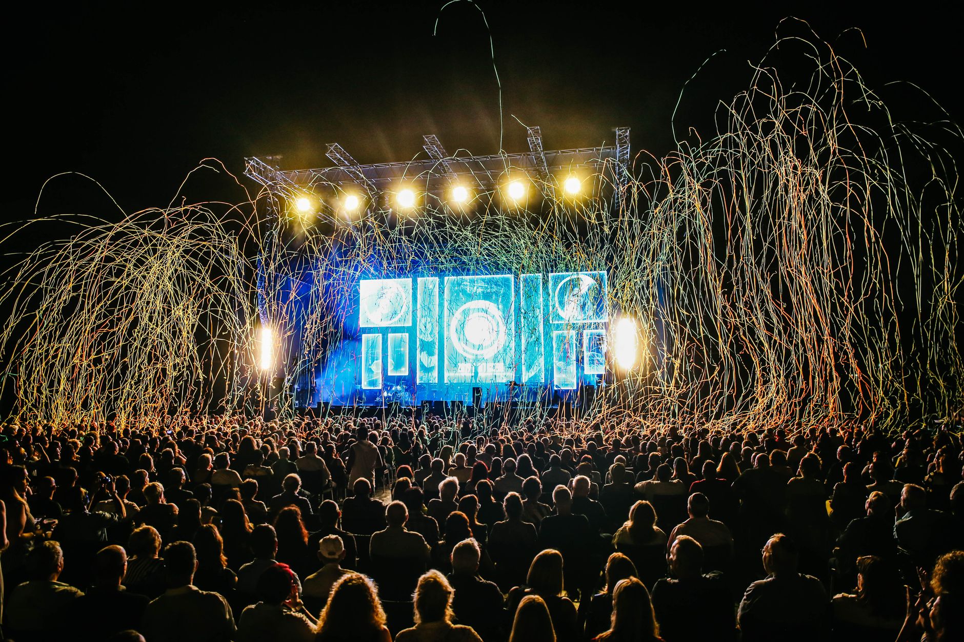 River City Fair Returns to Hoboken Waterfront With Music, Food, and a Nod to the 1970s Dynamic live music concert with vibrant stage lights and a lively crowd enjoying the night.